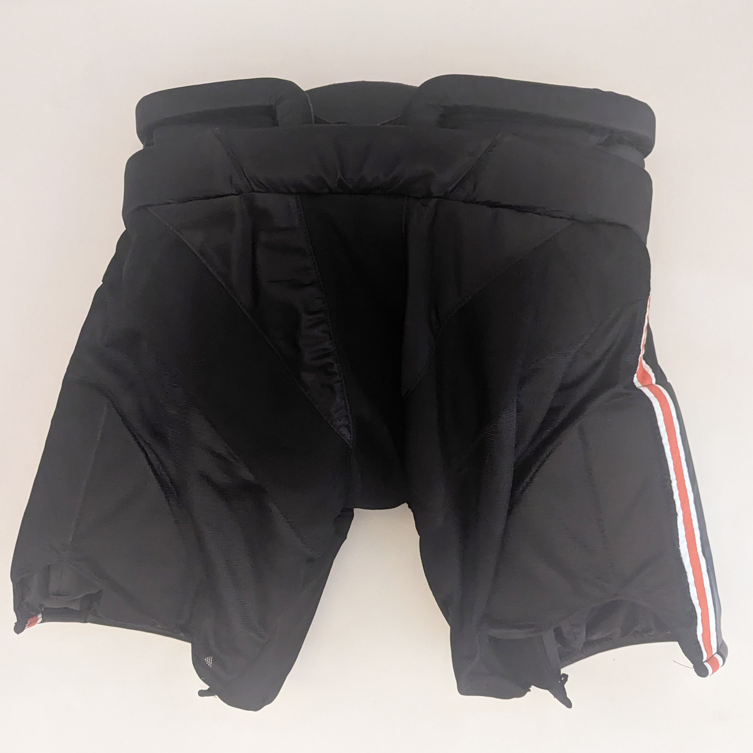 Bauer - Pantalon de gardien de but de hockey NCAA Pro Stock (noir/orange)